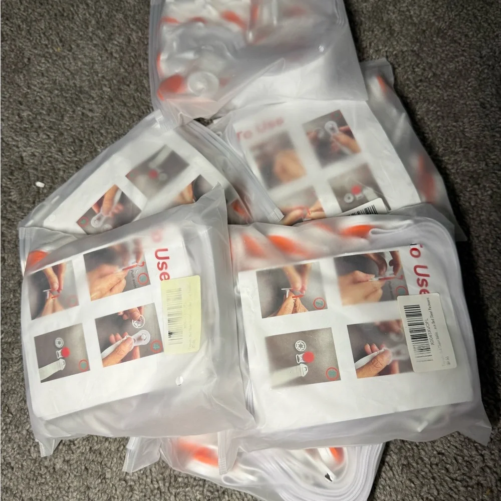 White Bed Sheet Fasteners with Orange Clips